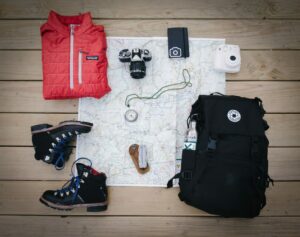 flatlay of safety gear to bring when hiking